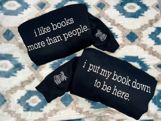 Book saying Sweatshirts